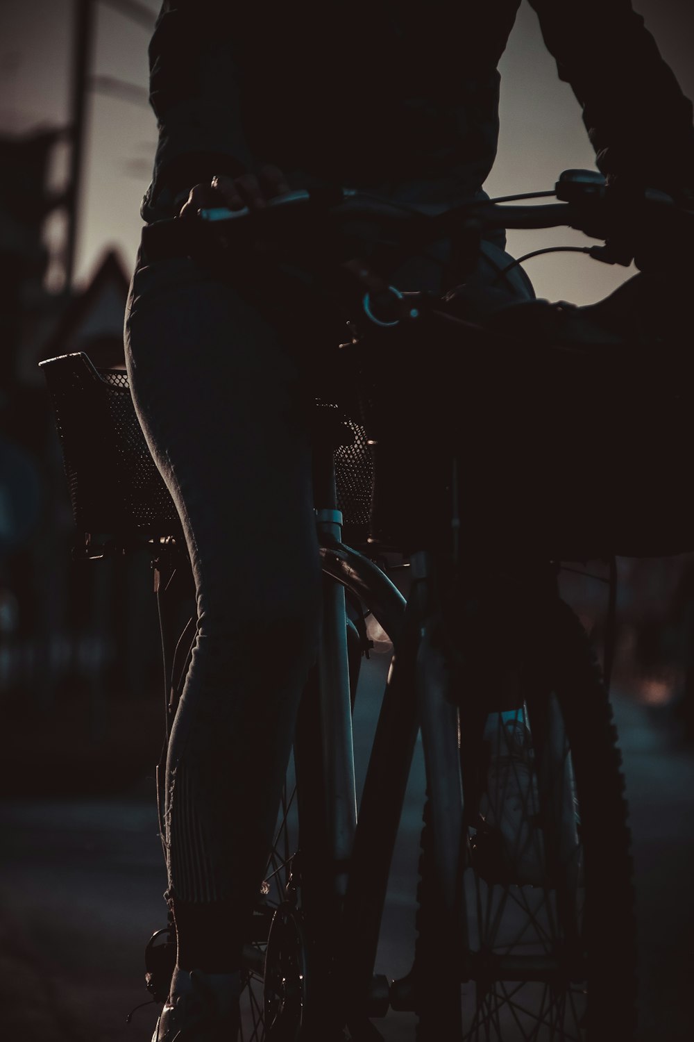 a person riding a bike on a city street