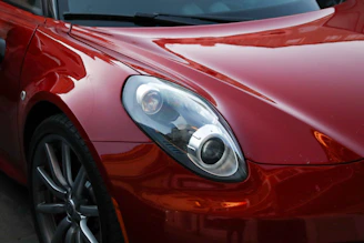a close up of a red sports car