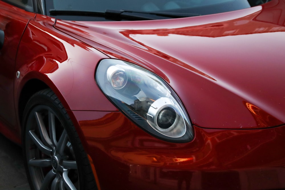 a close up of a red sports car