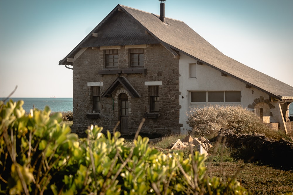 an old brick house with a steeple on the top of it