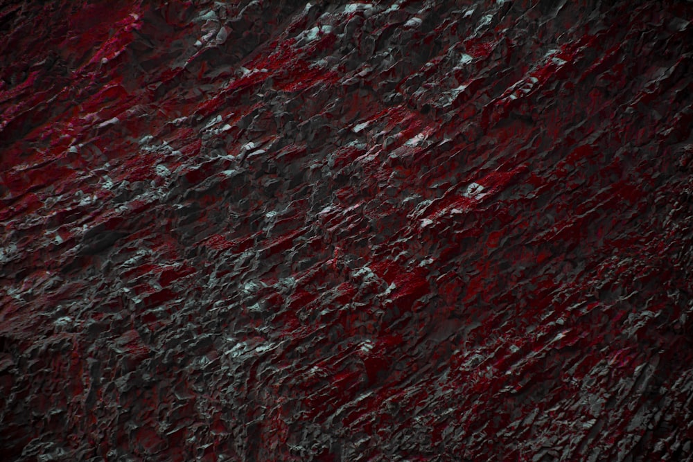 a black and red textured background with a white stripe