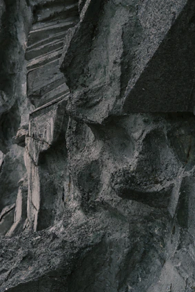 High-resolution image of a rugged stone being precisely cut by advanced machinery in a modern industrial setting.