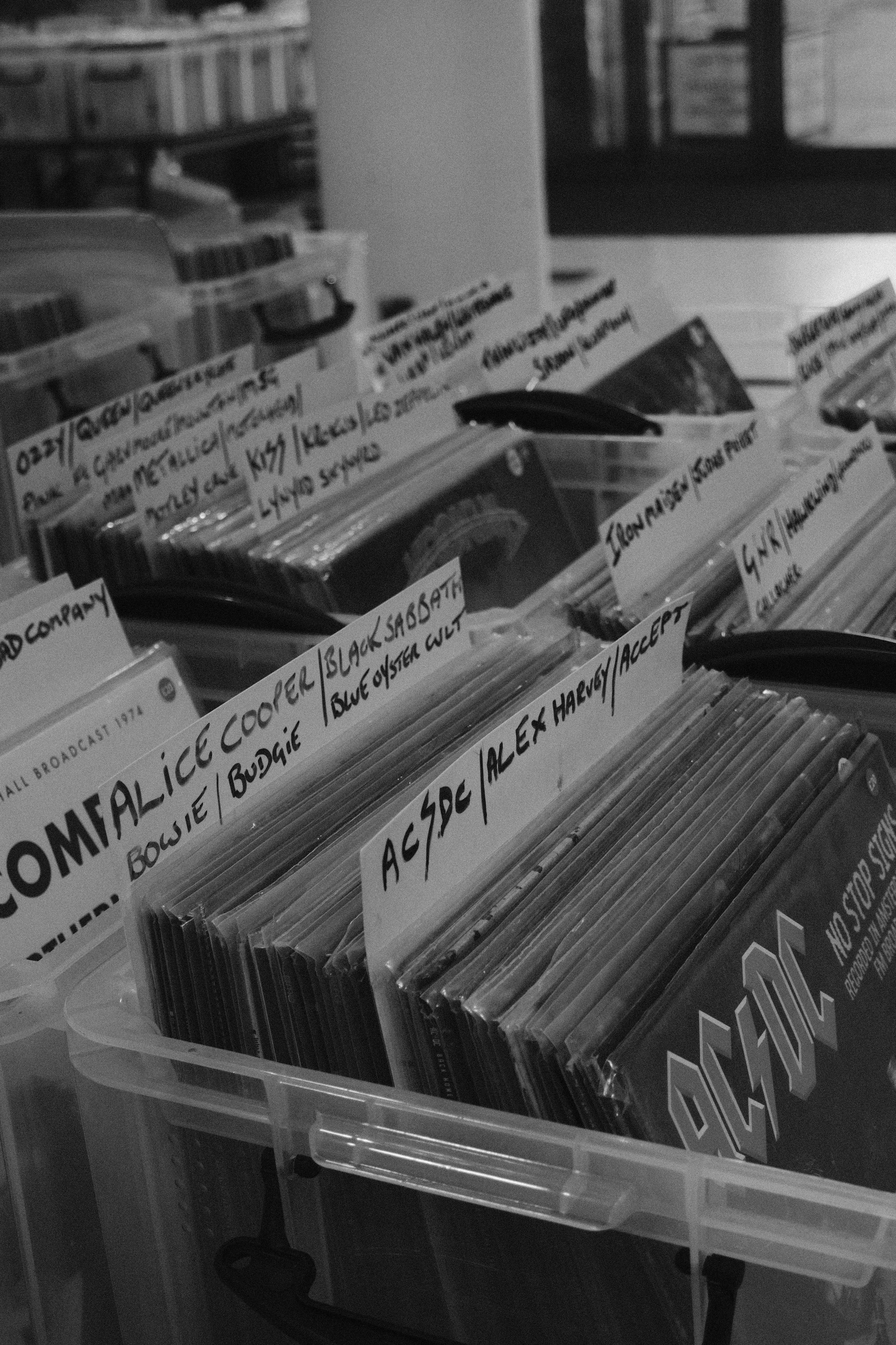 Close-up of vinyl material rolls in various colors and finishes, organized in a professional studio