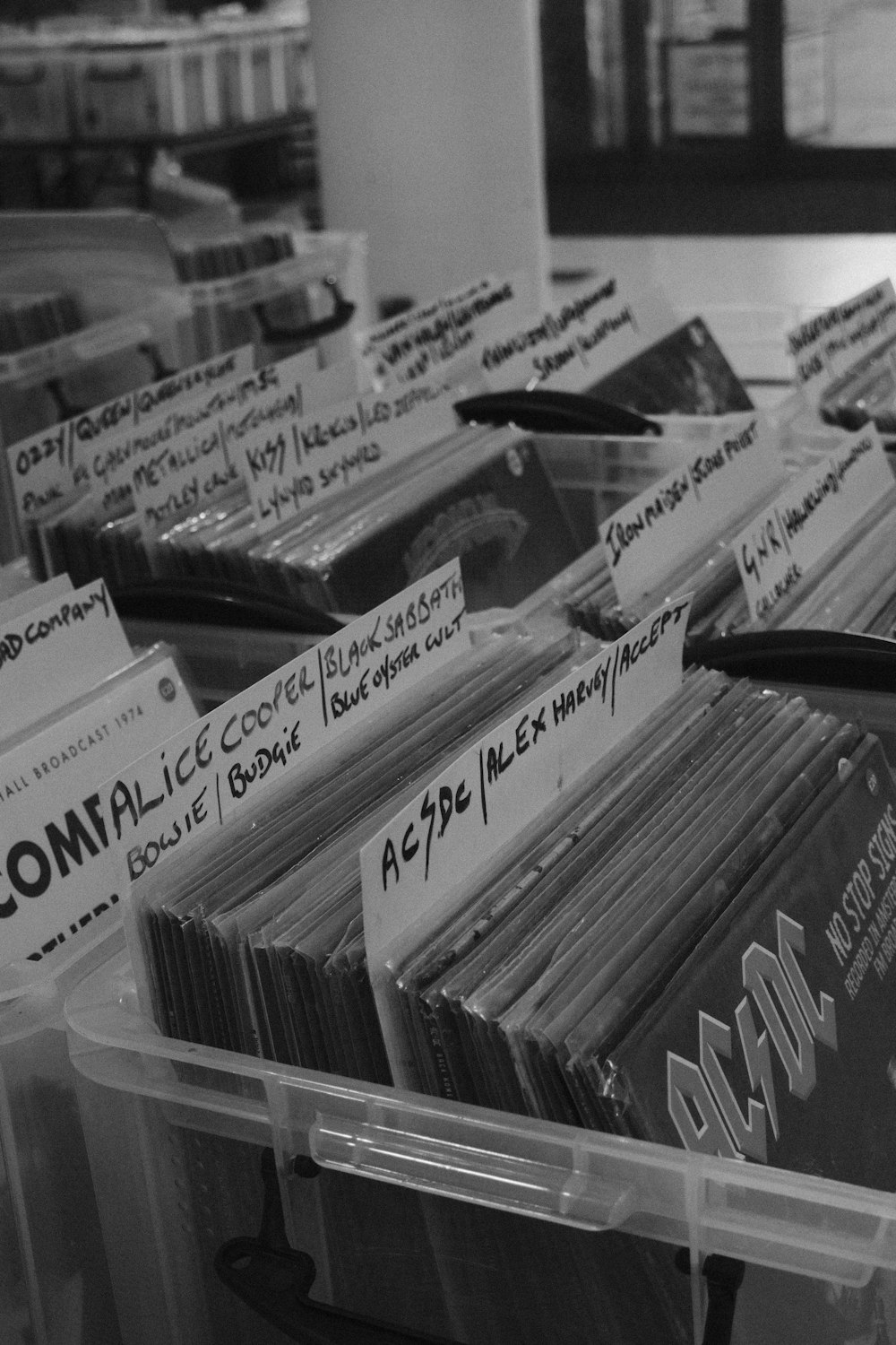 a bin filled with lots of records sitting on top of a table