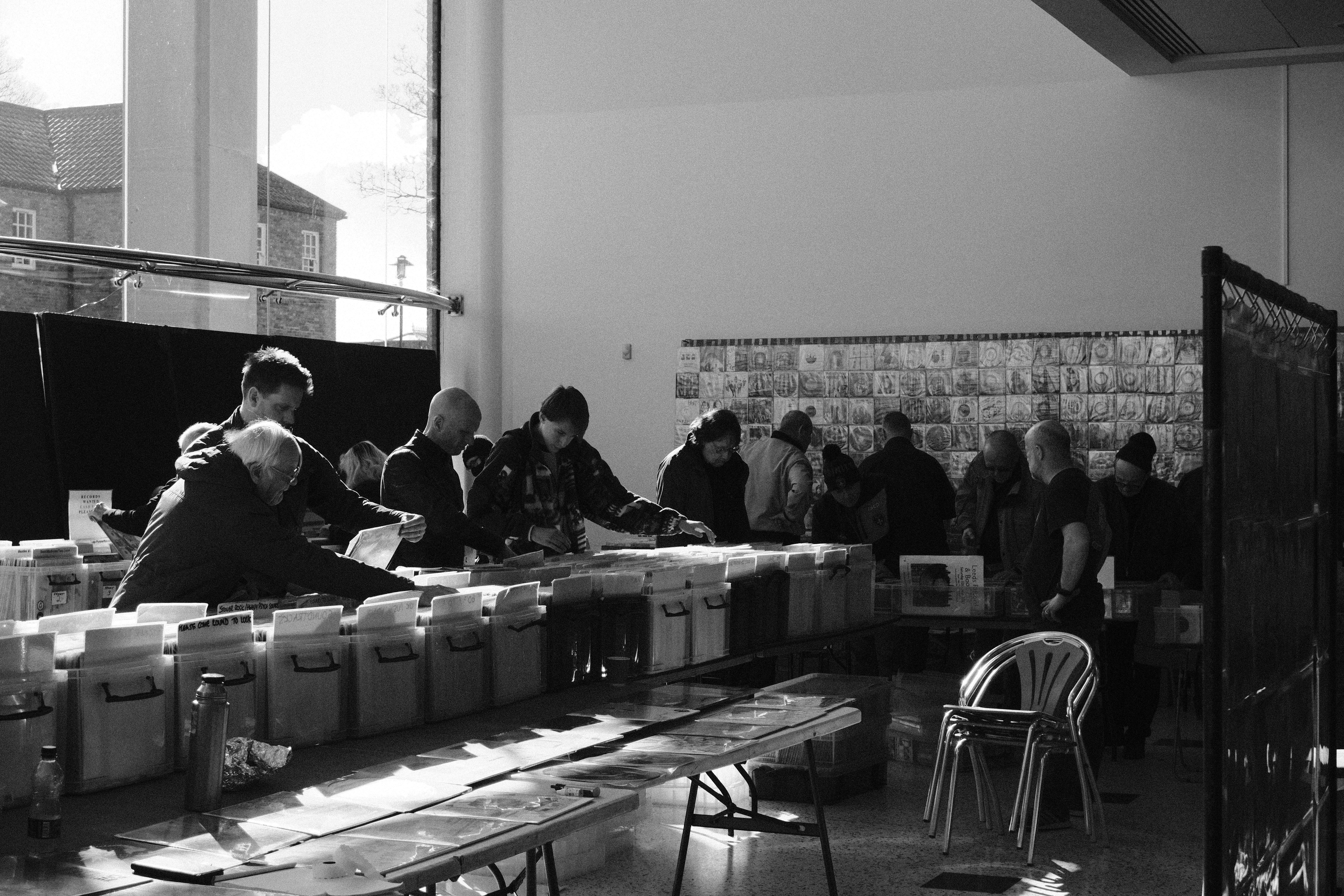 employees volunteering at food bank sorting donations - what are three ways businesses demonstrate corporate social responsibility