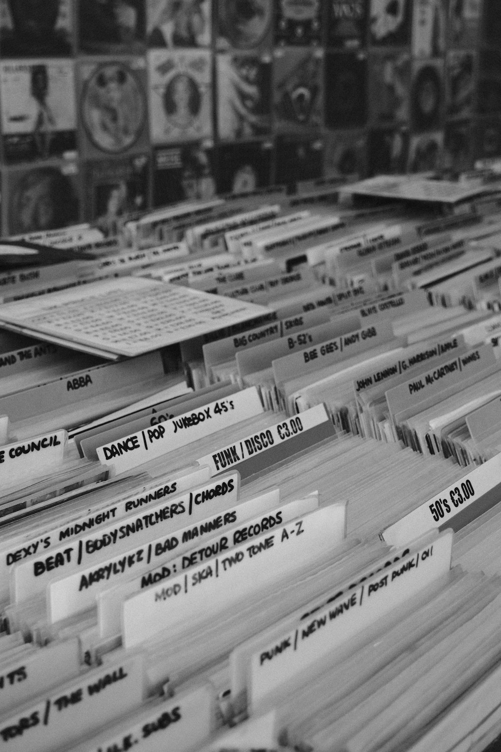 a black and white photo of a bunch of records