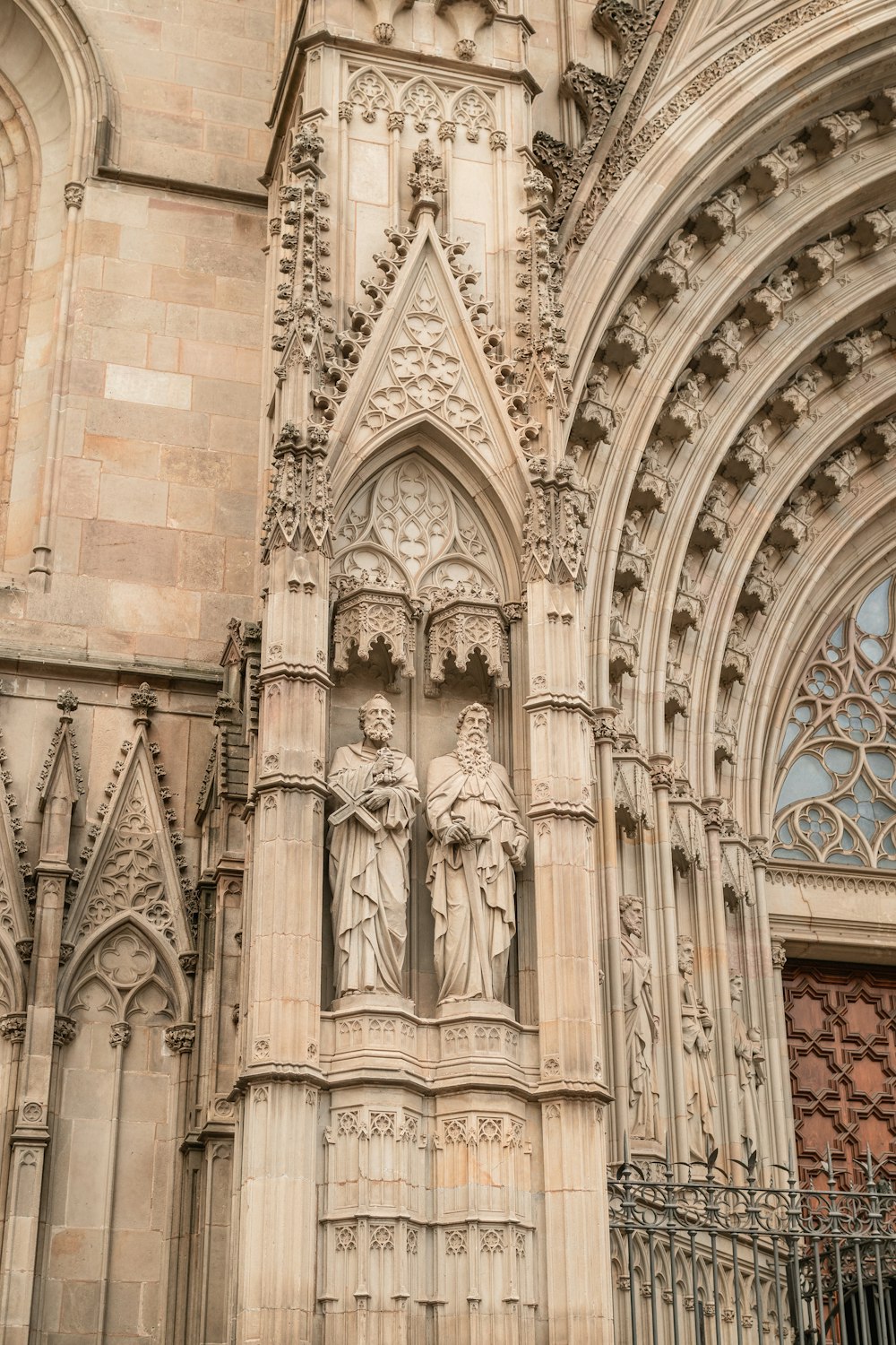 a large cathedral with statues on the side of it