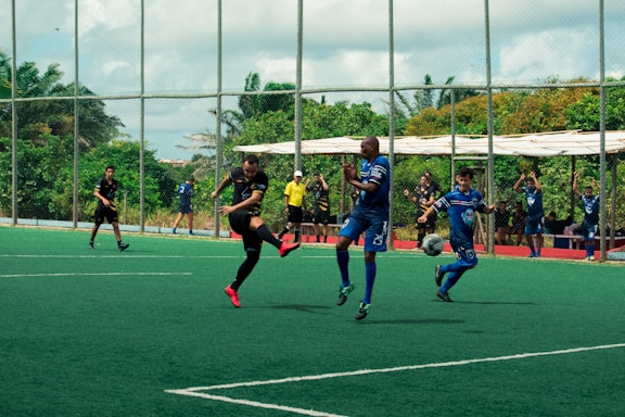 a group of young men playing a game of soccer