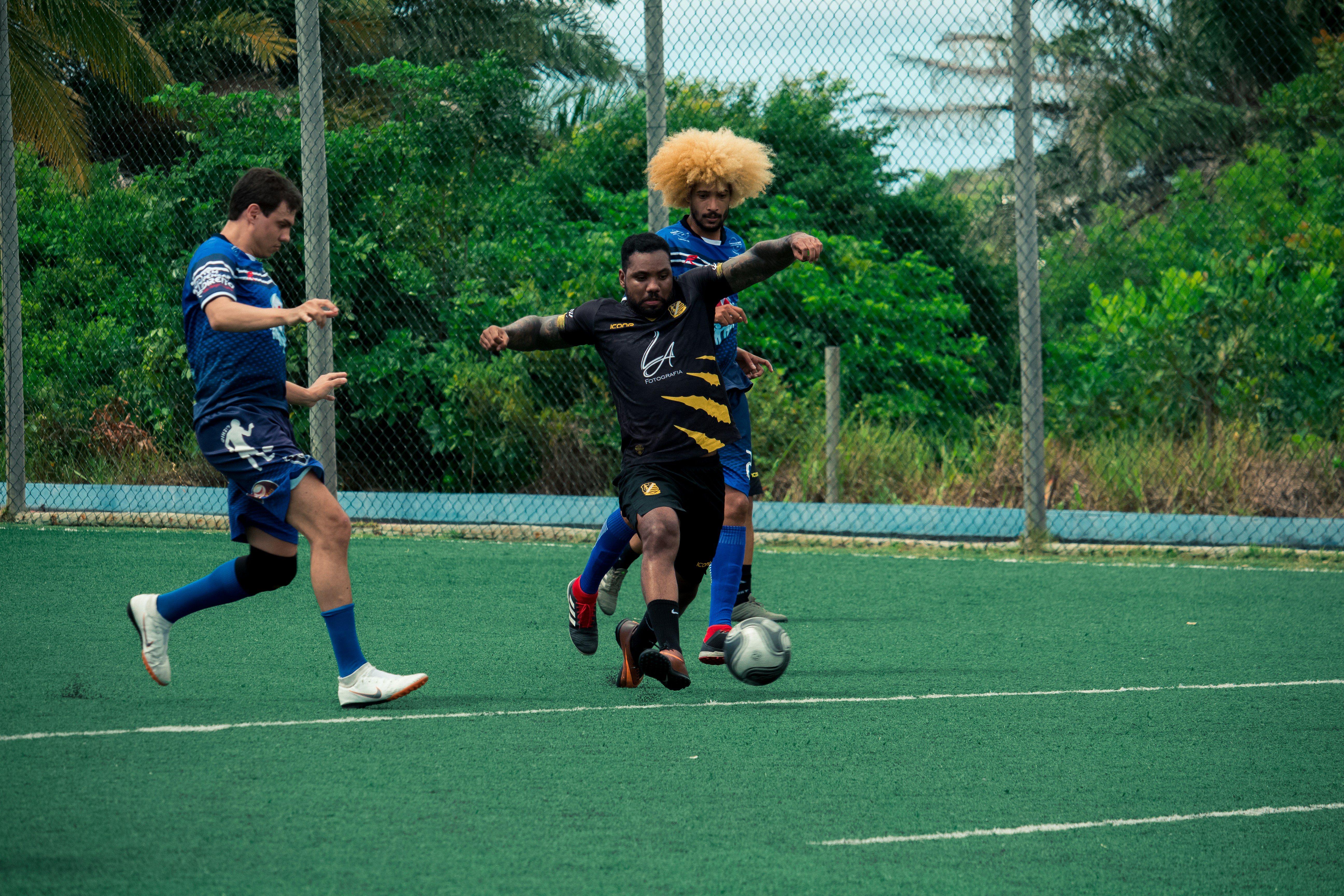 a group of young men playing a game of soccer