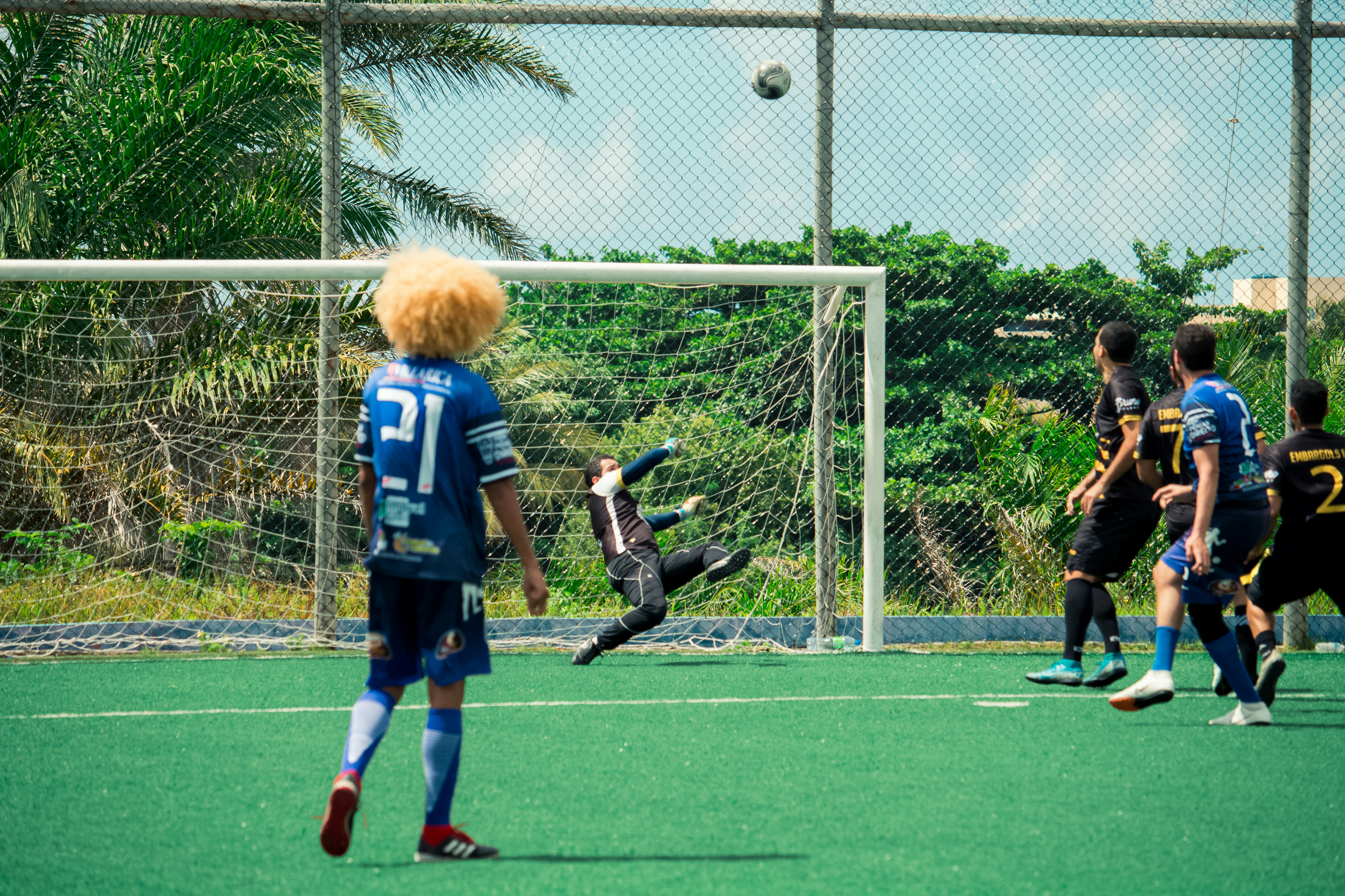 a group of young men playing a game of soccer