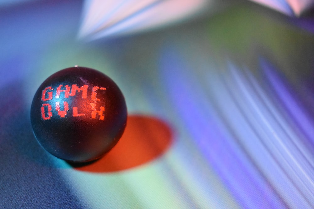 a close up of a ball with the word game on it