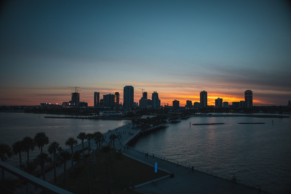 a view of a city skyline at sunset