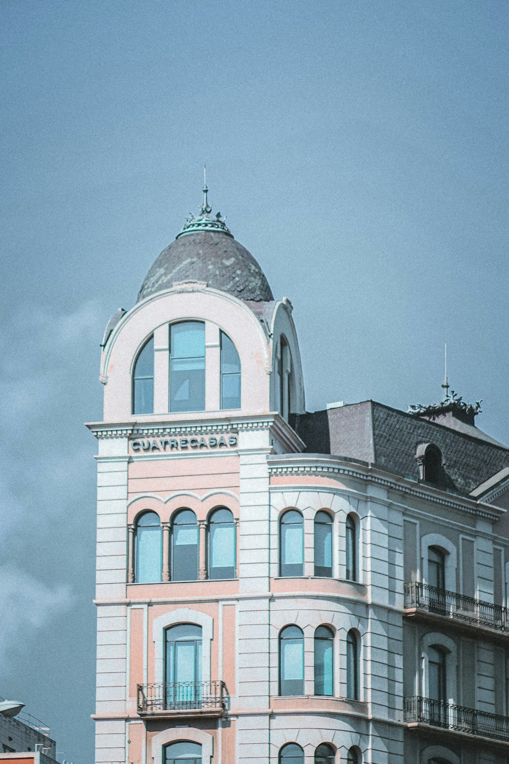 a tall building with a clock on the top of it