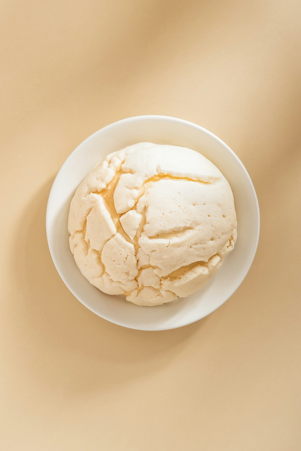 a white bowl filled with food on top of a table