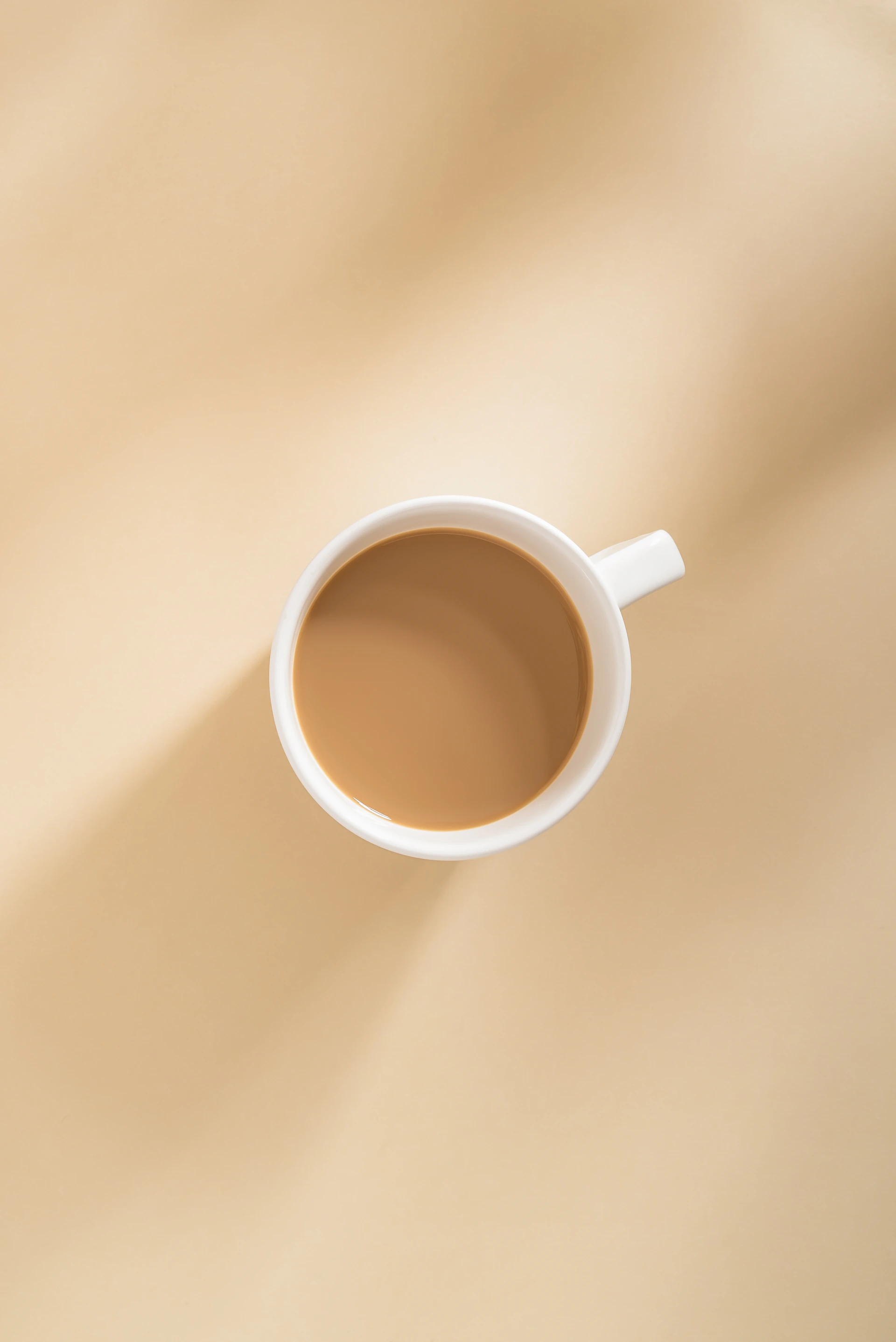 a cup of coffee sitting on top of a table
