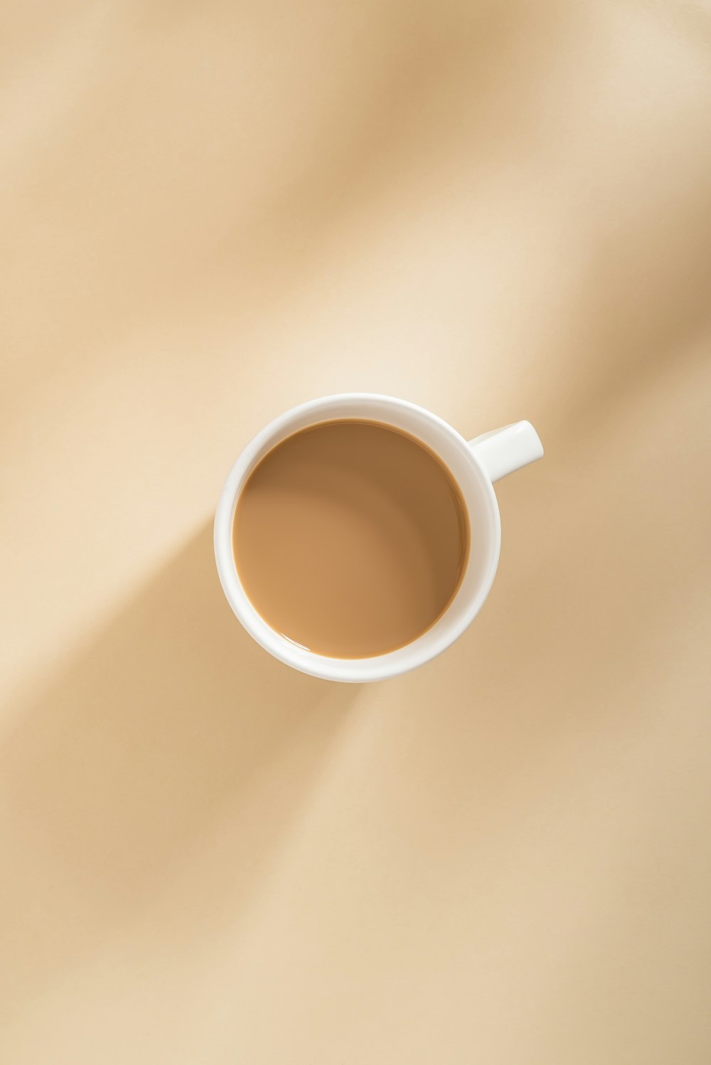 a cup of coffee sitting on top of a table