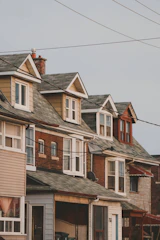 a row of houses on a cloudy day