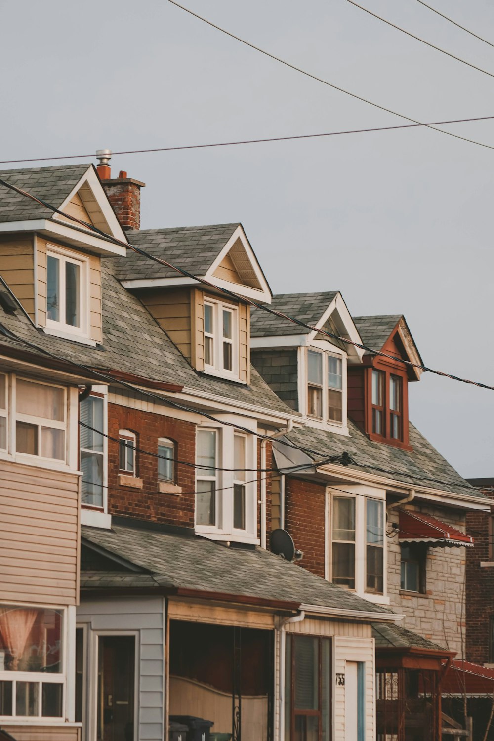 a row of houses on a cloudy day