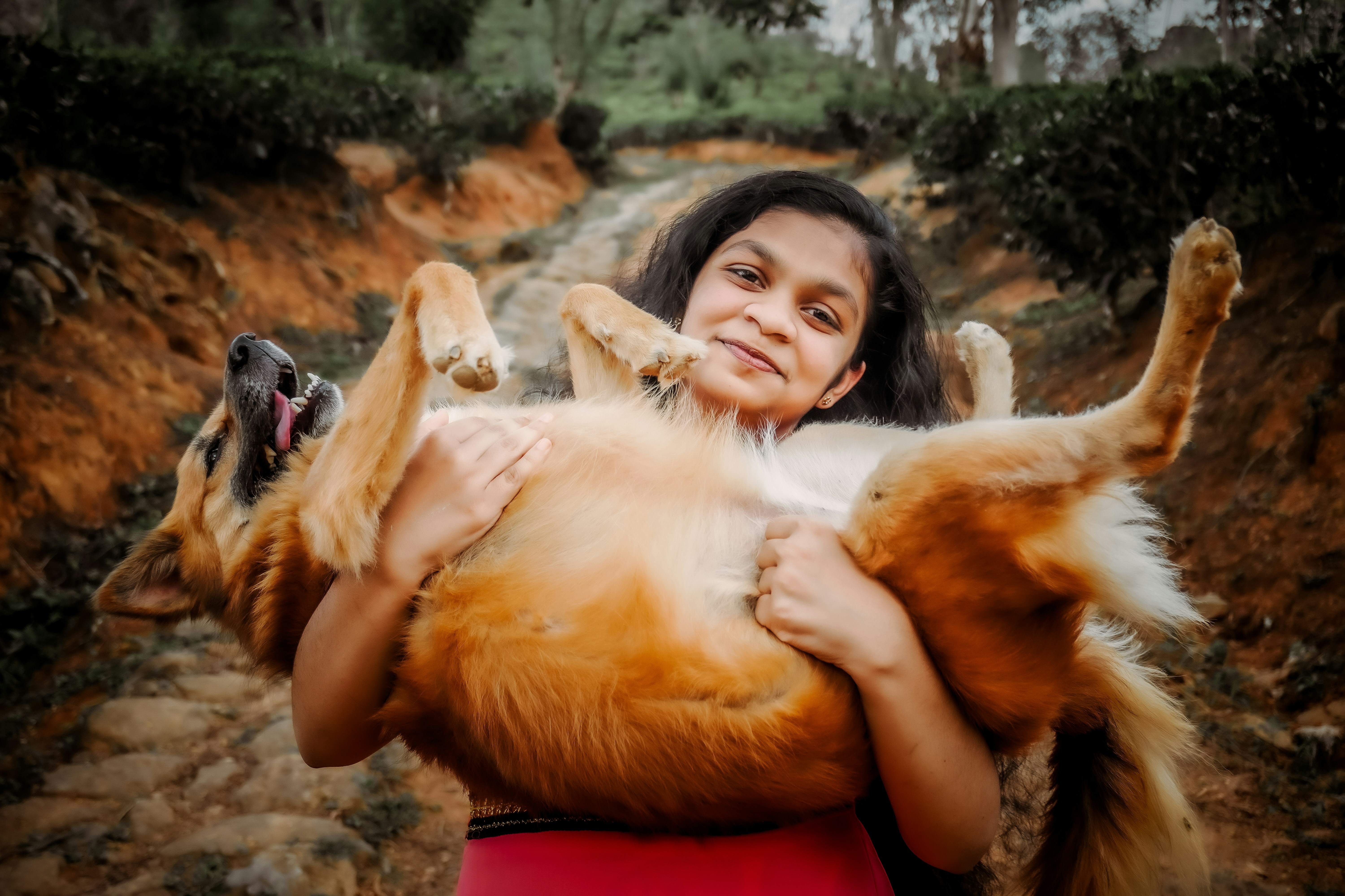 Woman holding a large dog