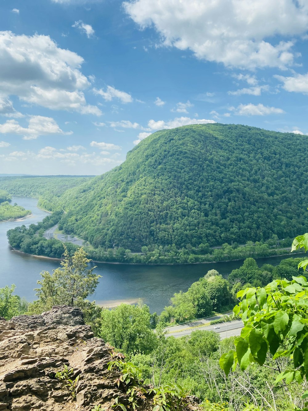 a scenic view of a river surrounded by mountains