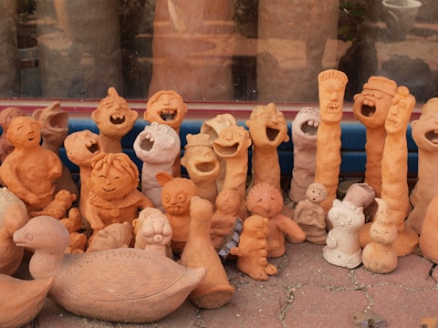 a group of clay animals sitting next to each other