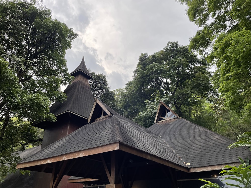 a wooden structure with a steeple on top of it