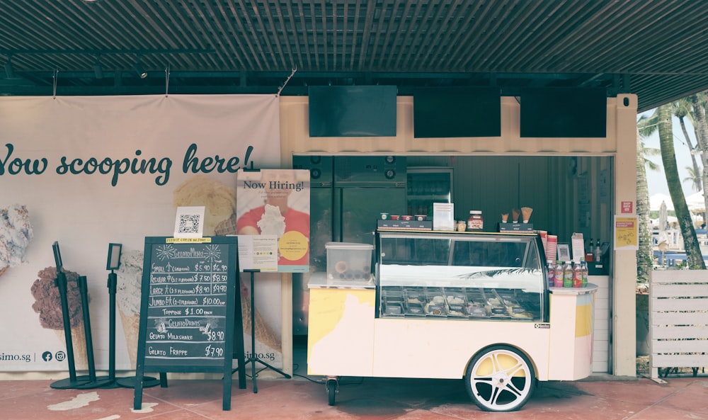 a food cart sitting in front of a building