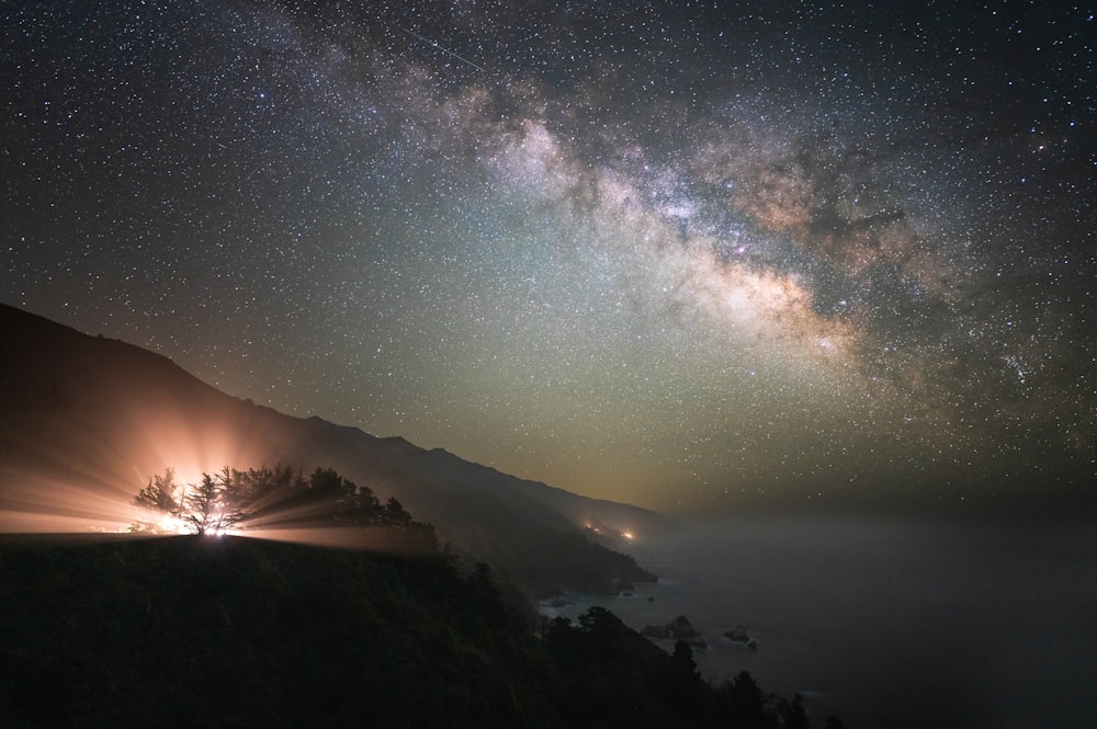 a view of the night sky with the milky in the background