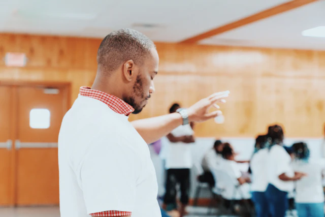 Administrator addressing colleagues in a meeting room