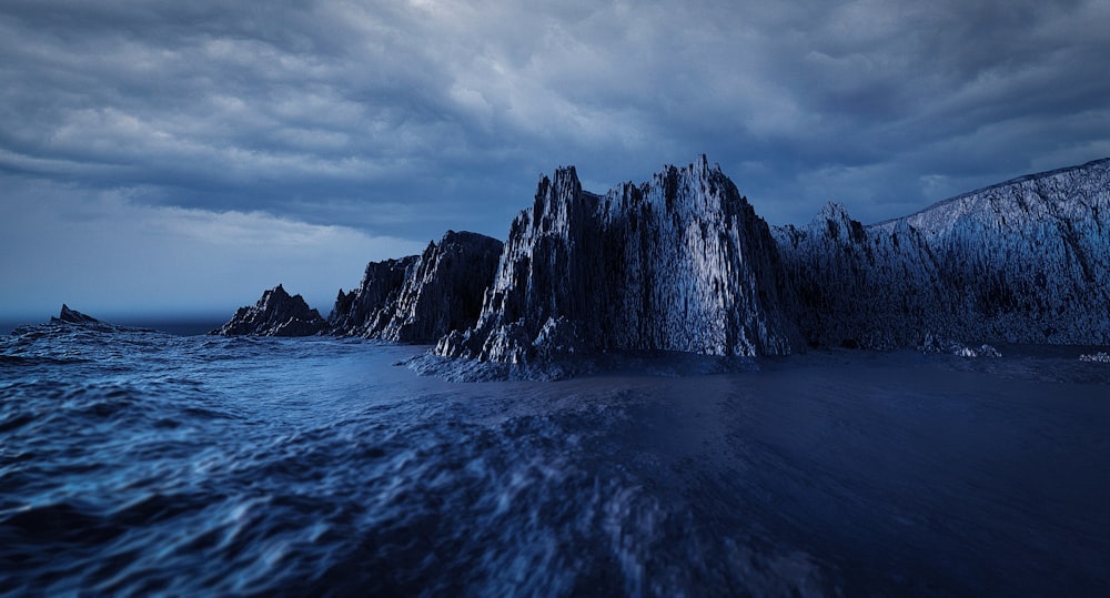 a group of rocks sitting on top of a body of water