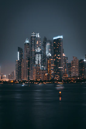 a large body of water with a city in the background