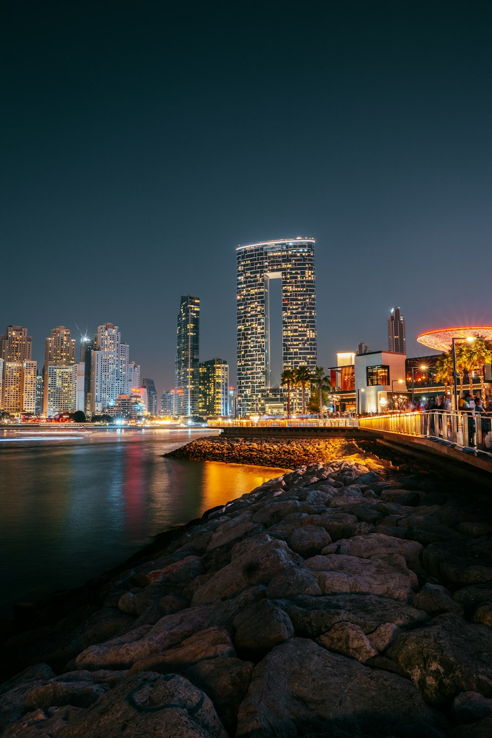 a view of a city at night from the water