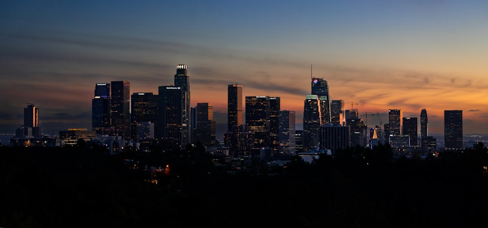 a view of a city skyline at sunset