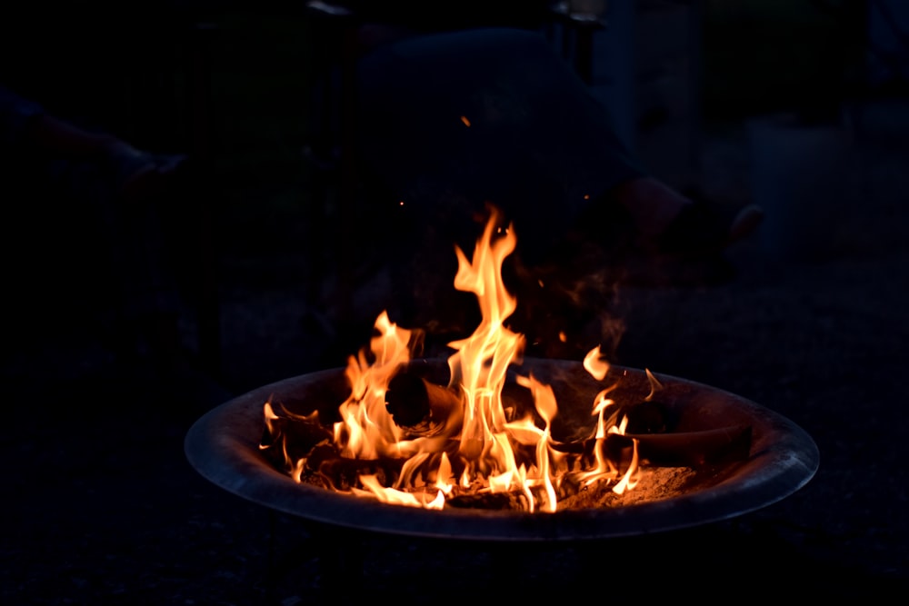a close up of a fire pit in the dark