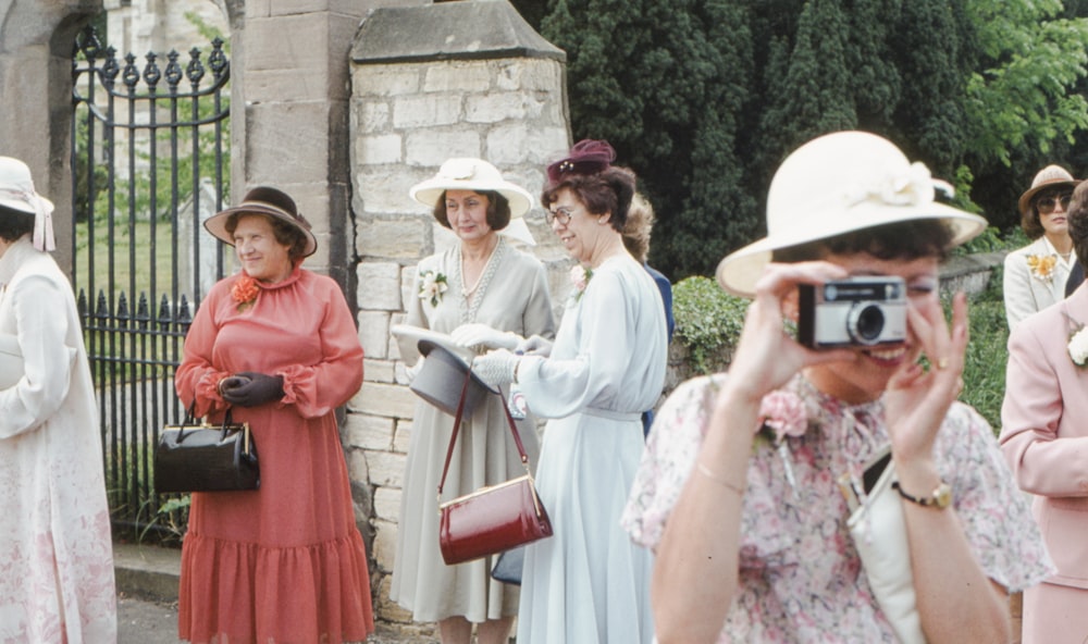 a group of women standing next to each other