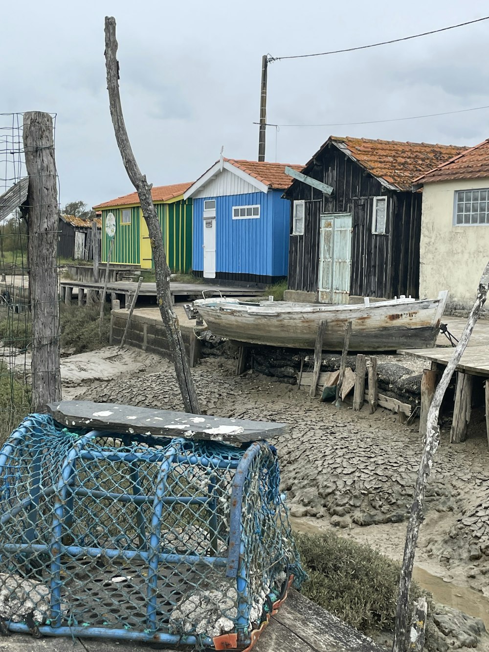 a boat sitting on top of a sandy beach