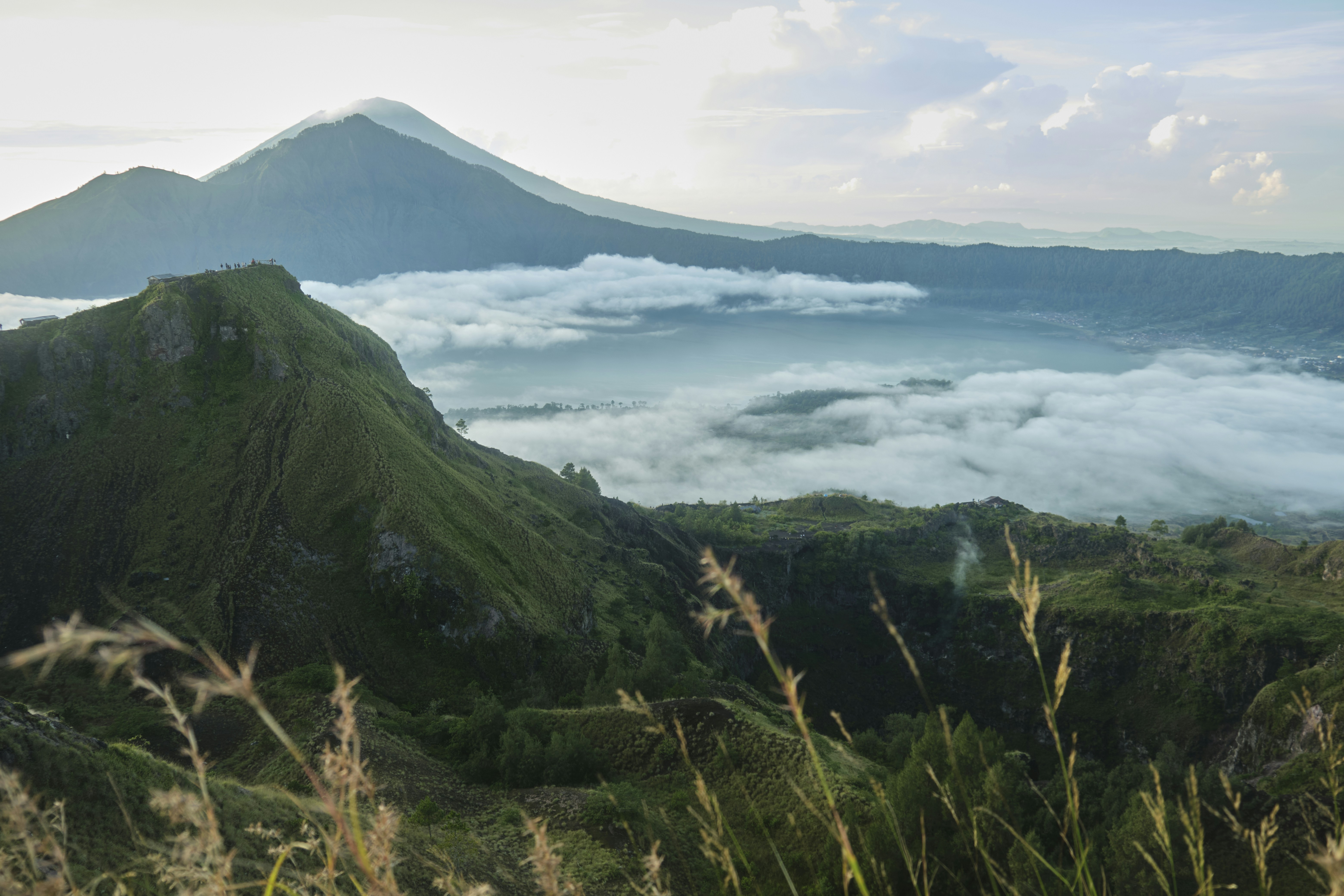 a view of a mountain covered in clouds