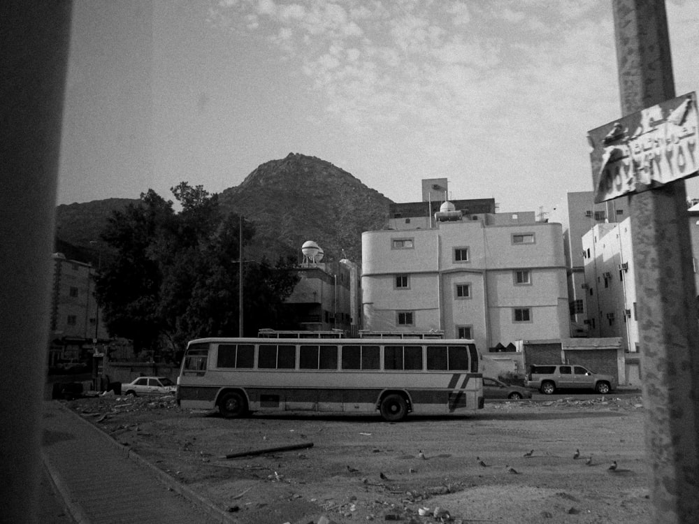 a bus parked in a parking lot next to a building