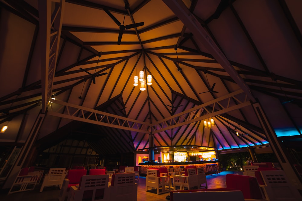 a room with a ceiling that has a light fixture hanging from it