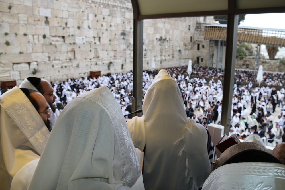 a group of people sitting in front of a crowd of people