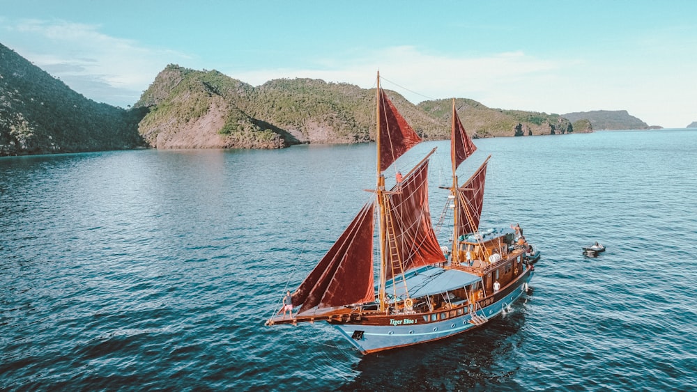 a sailboat in the middle of a body of water