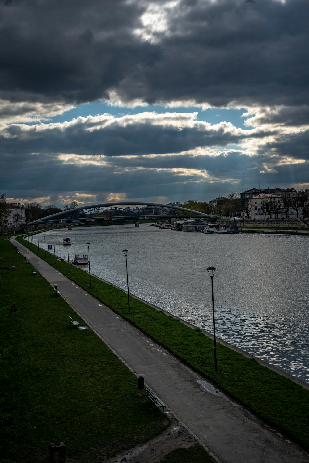 a body of water with a bridge in the background