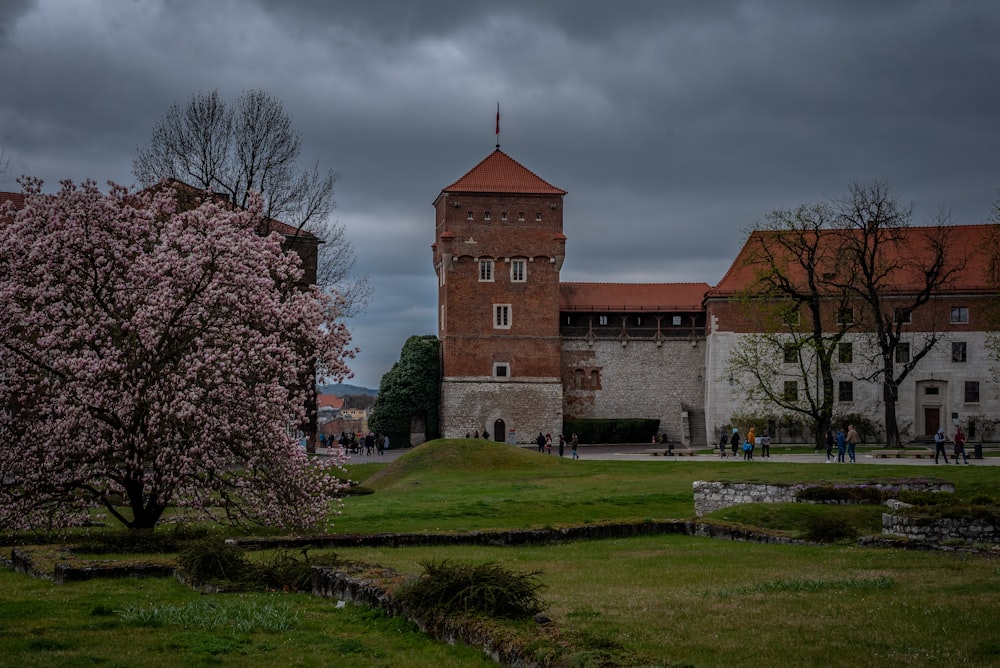 a large brick building with a clock tower