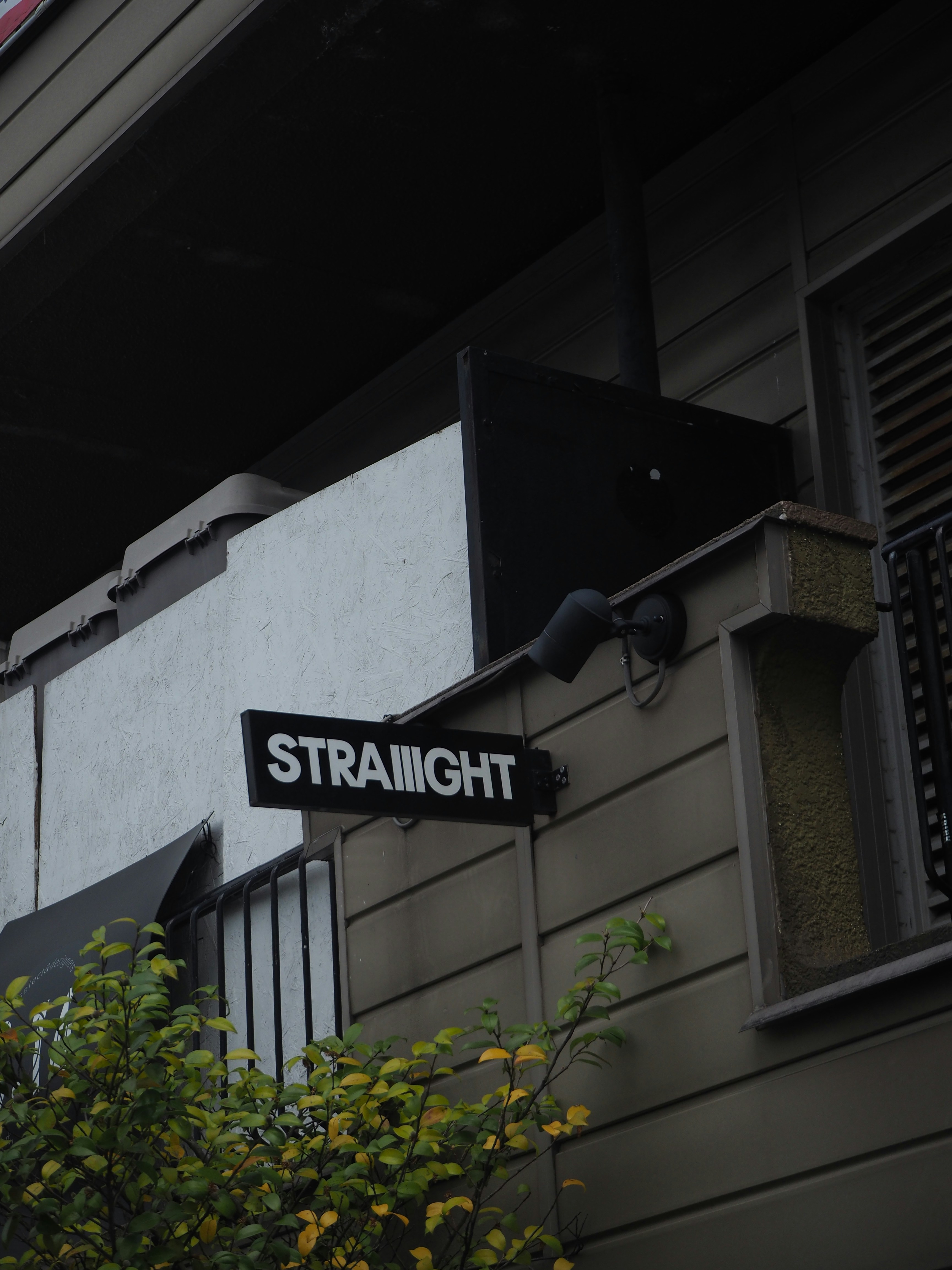 a street sign on the corner of a building