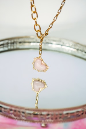 a close up of a necklace on a table