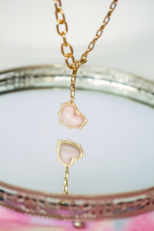 a close up of a necklace on a table