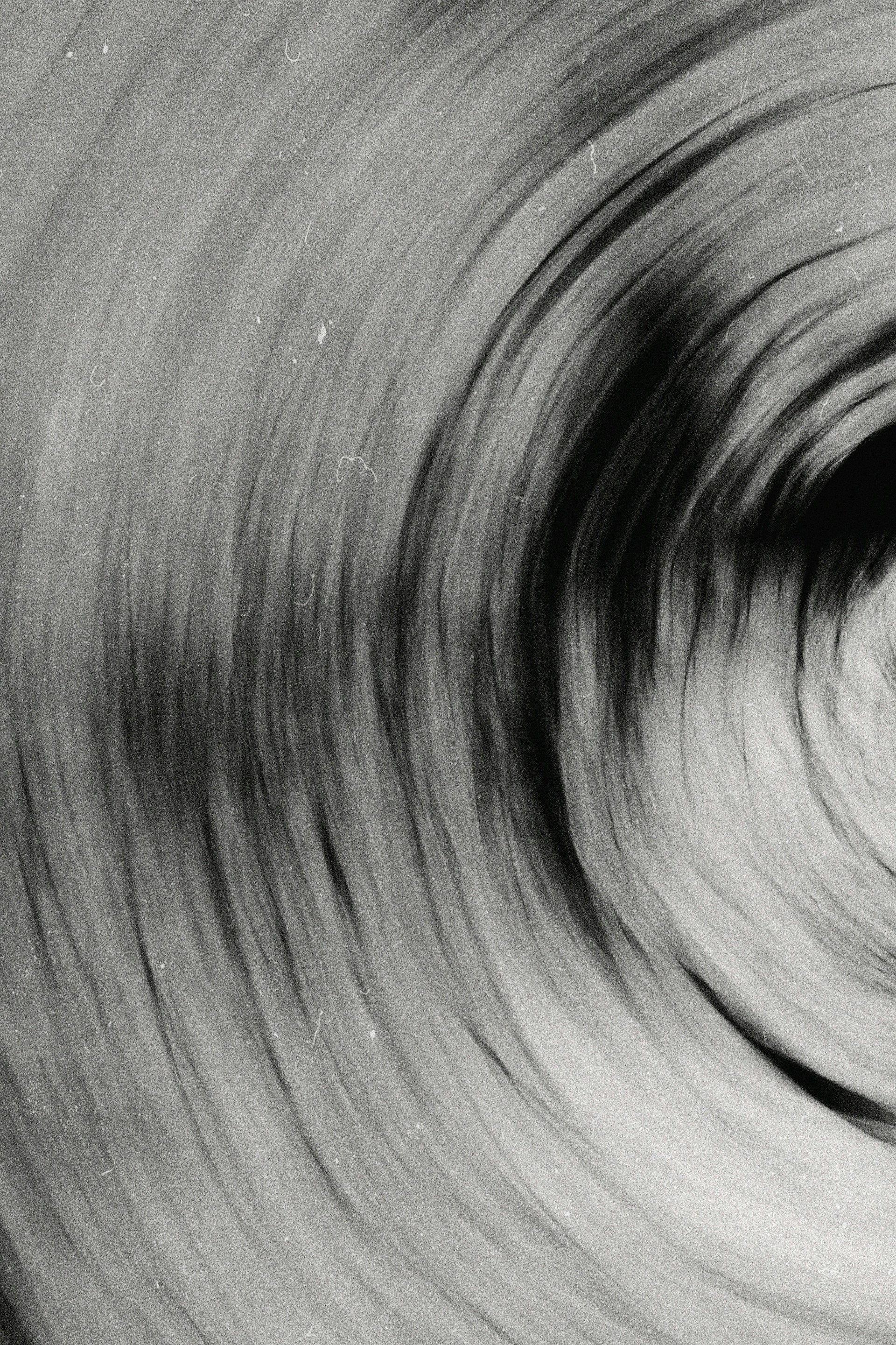 a black and white photo of a circular object