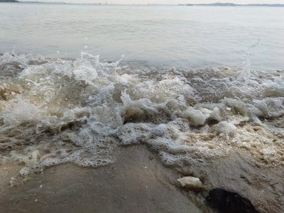 Soothing waves softly crashing on a quiet beach.