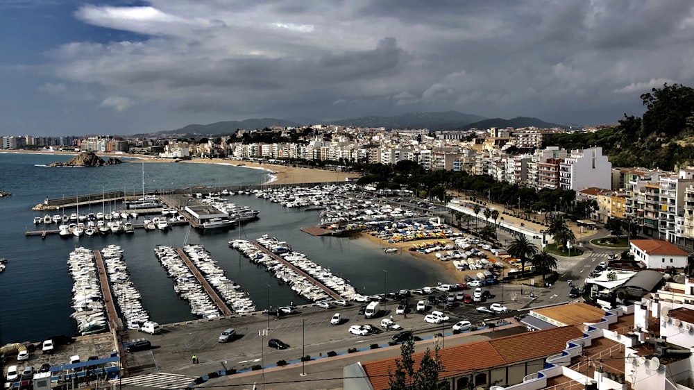 a harbor filled with lots of boats under a cloudy sky