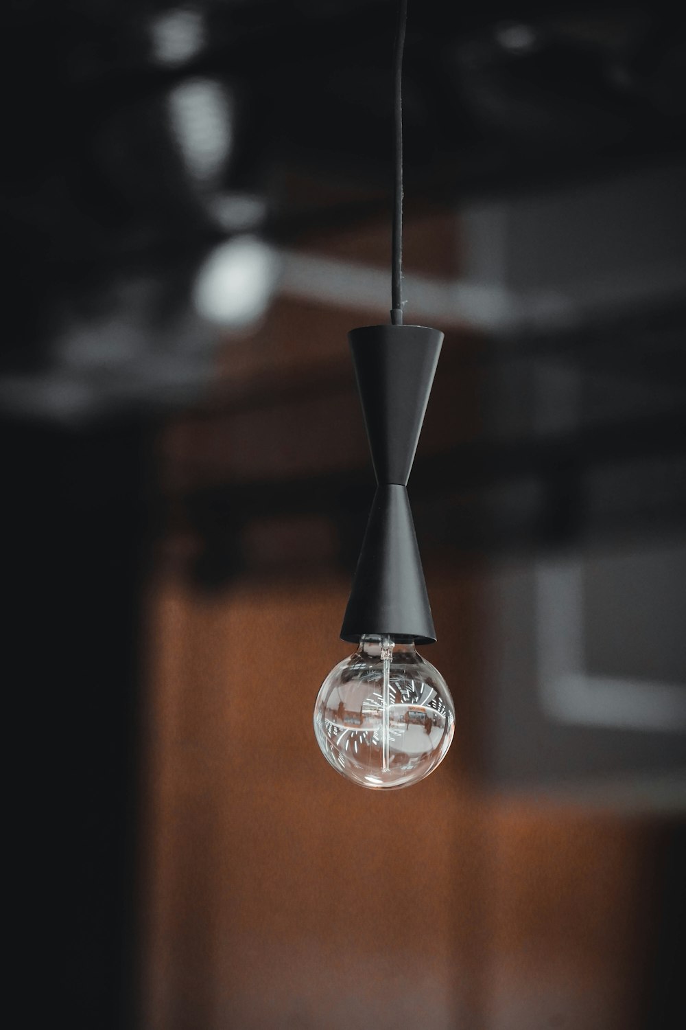 a light bulb hanging from a ceiling in a room